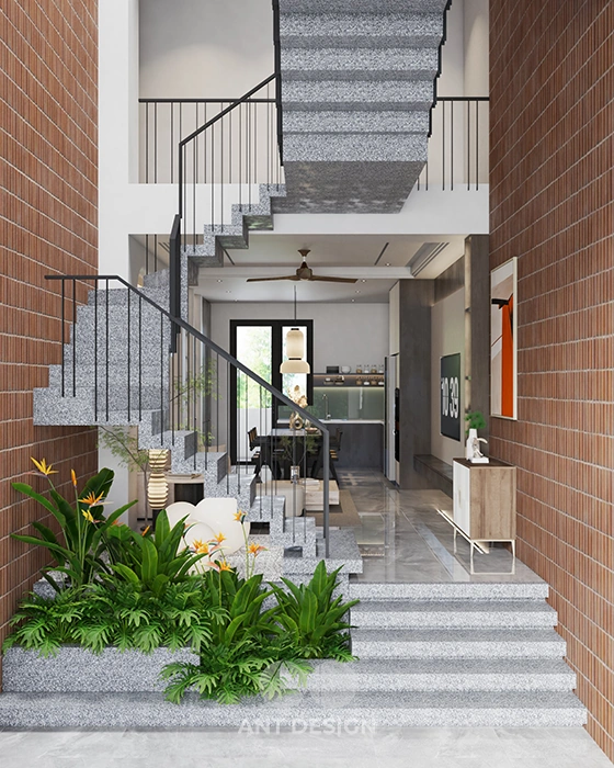 Khu vực cầu thang với tường gạch mộc và gạch kính lấy sáng