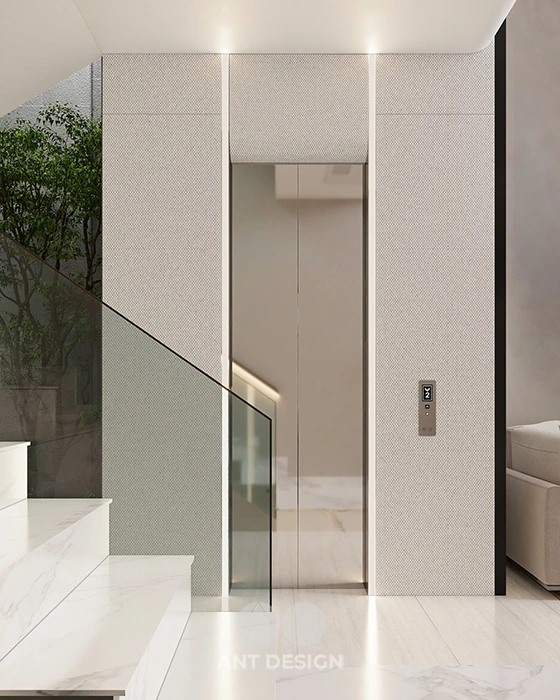 Thang máy gia đình vách kính viền inox mạ vàng